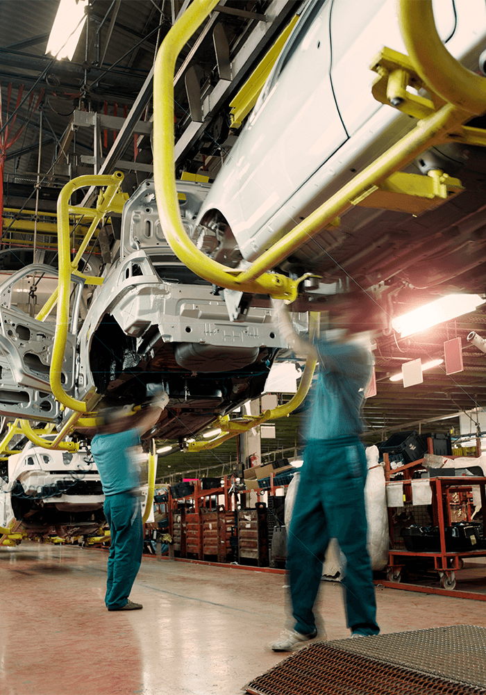 Production line with vehicle bodies in an automobile factory.