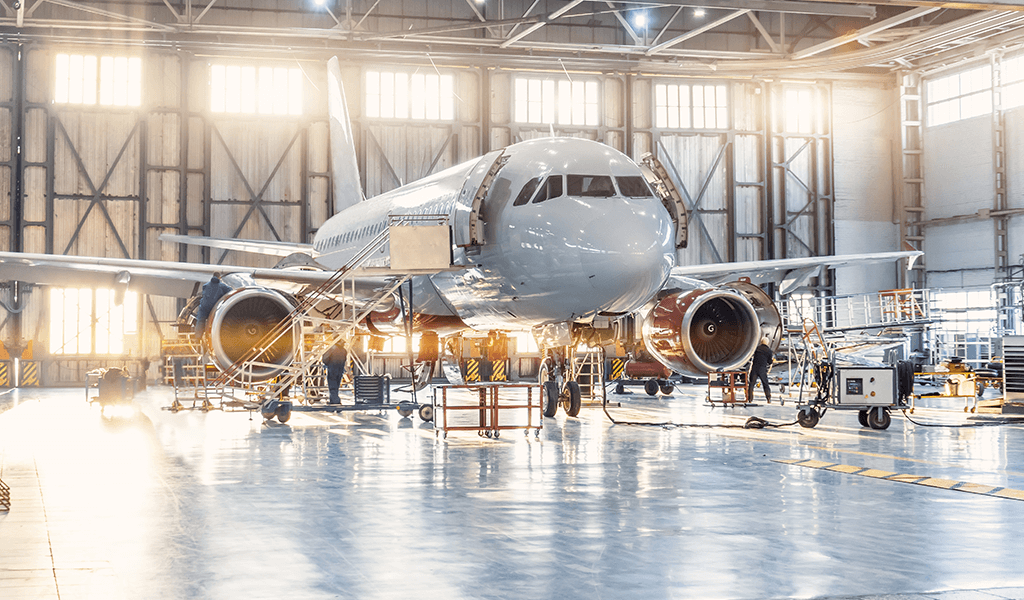 Packaging solutions for aviation – aircraft in a hangar.
